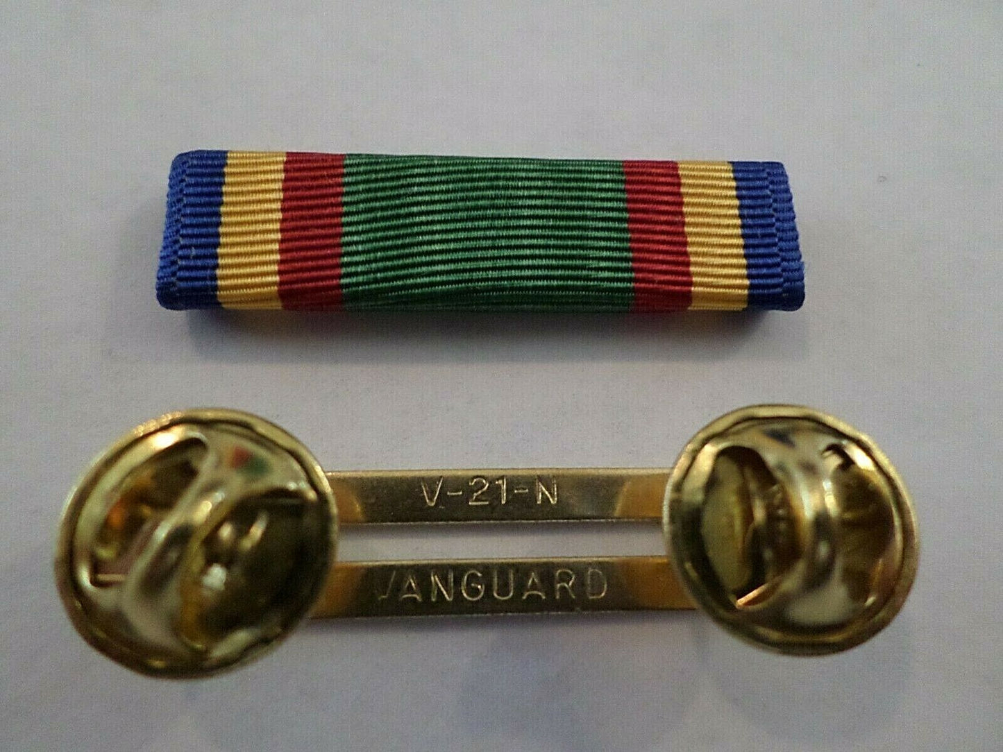 NAVY UNIT COMMENDATION RIBBON WITH BRASS RIBBON HOLDER US MILITARY